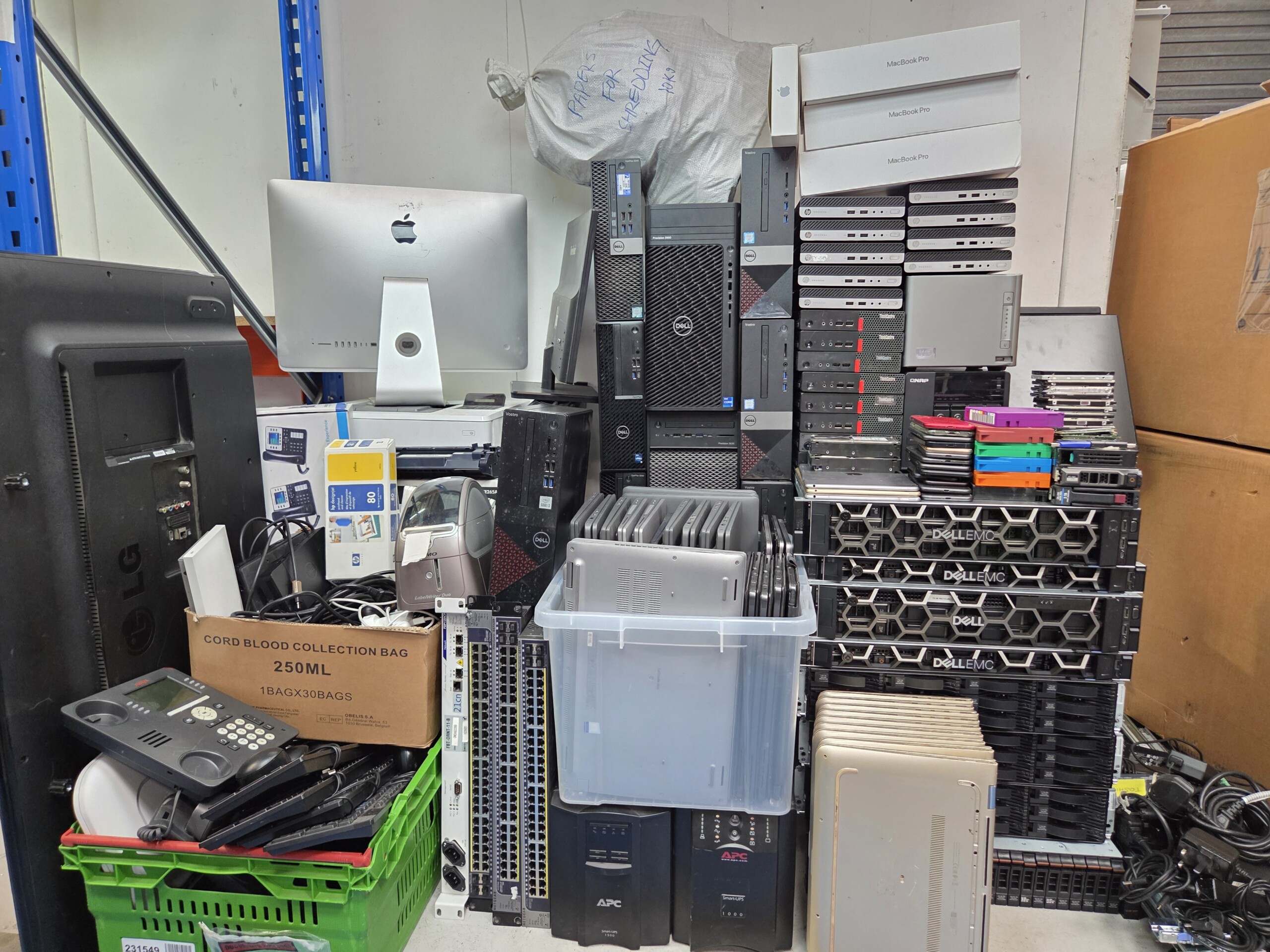 Certified engineer auditing and assessing IT equipment for disposal