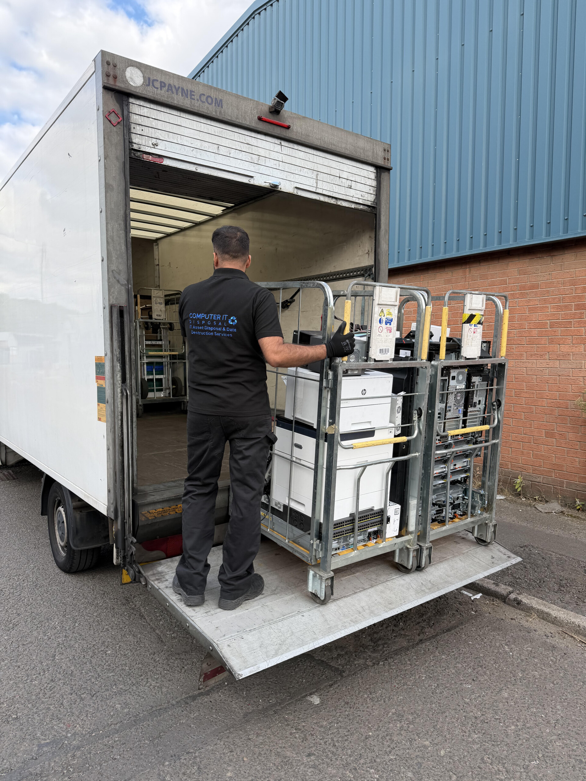 Consignment being loaded into a BS-7858 security vetted van for IT equipment disposal