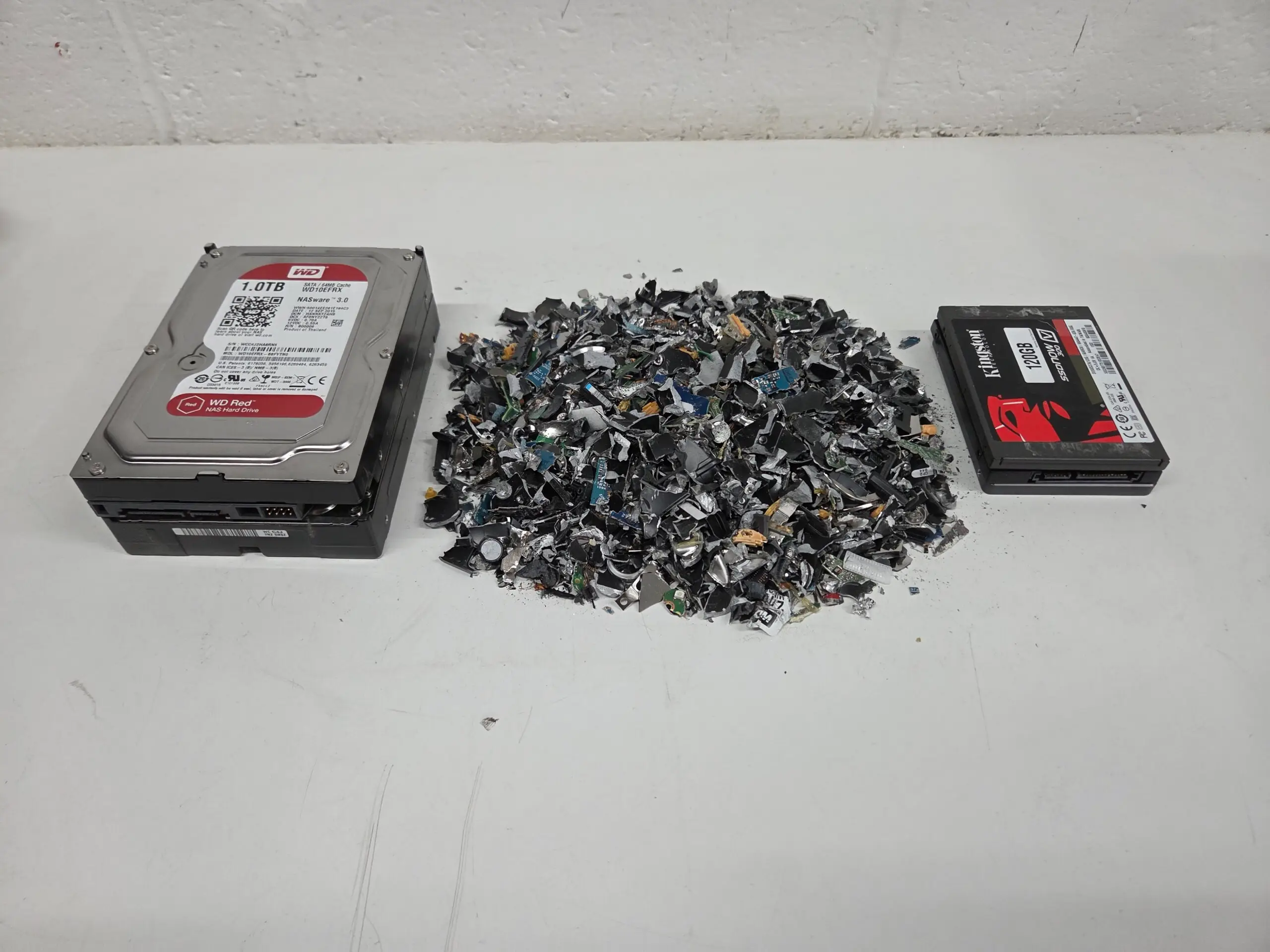 Shredded hard drive media ready for certified destruction documentation