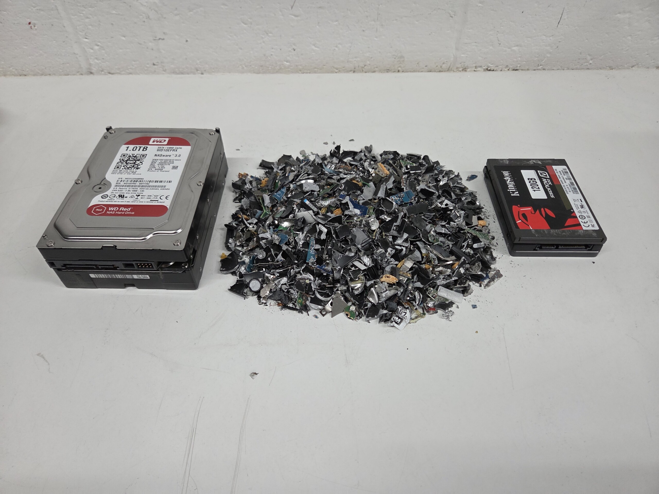 Shredded hard drive media ready for certified destruction documentation